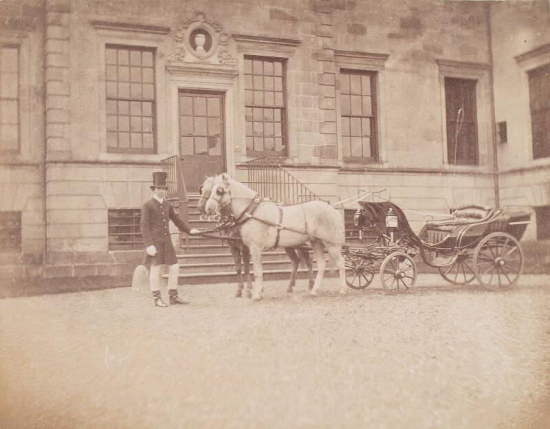 Coach and Horses before a large House