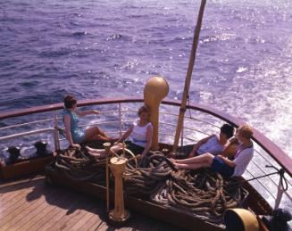Female passengers seated amongst some ropes at the stern of St Ninian (II)