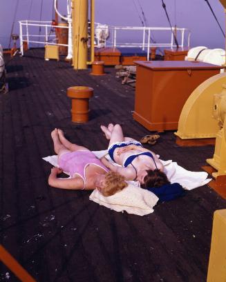 Two female passengers sunbathing on the deck of St Ninian (II)