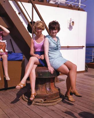Two female passengers seated on a capstan aboard St Ninian (II)