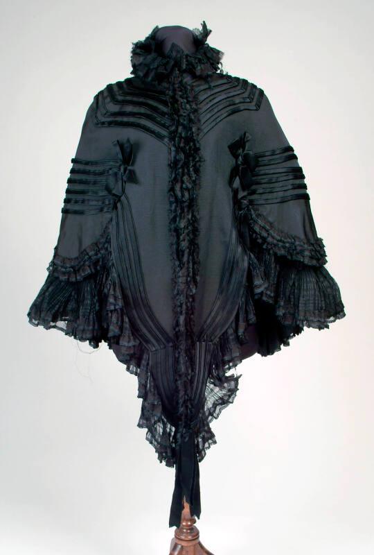 Black Corded Silk Cape with Crepe Frill – Works – eMuseum