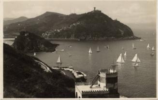 San Sebastian - View of yachts on the sea with Mount Urgull in the background