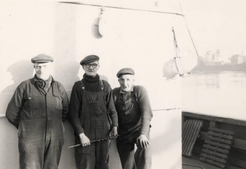 Black and white photograph showing workers from the John Lewis shipyard