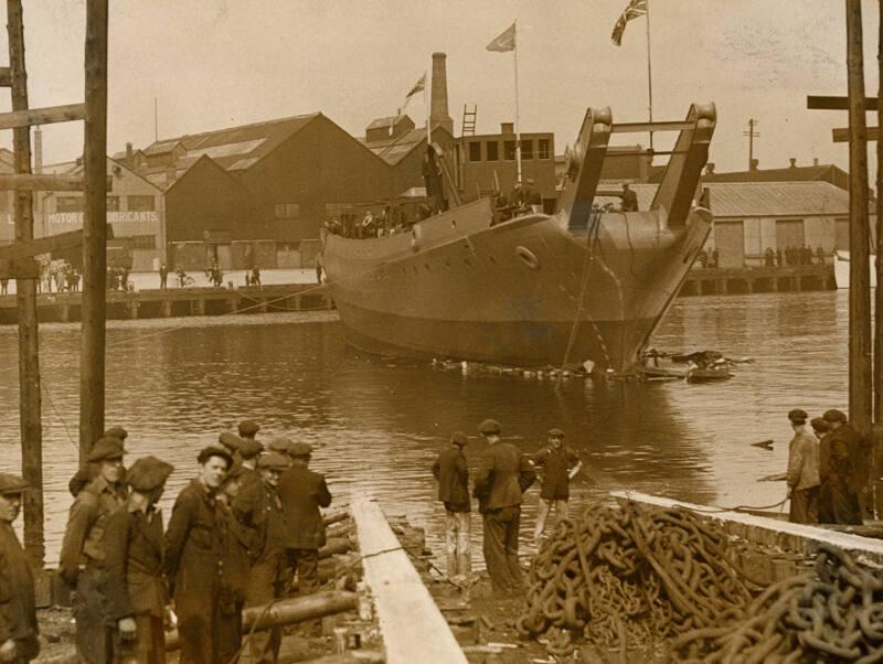 Photograph in album showing John Lewis built vessel, possibly boom defence vessel Barrage