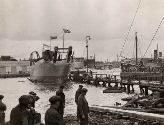 Photograph in album showing John Lewis built vessel, possibly boom defence vessel Barfair or Ba…
