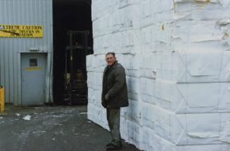 Employee by Bales of Pulp Donside Papermill