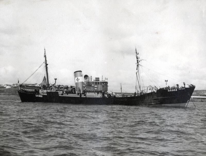 Photograph in album showing vessels built at John Lewis