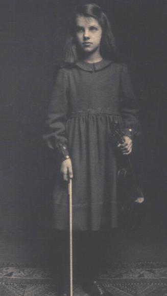 Phyllis Allan holding a violin 