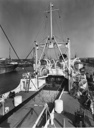 Black and white photograph showing the deck of the factory trawler 'Fairtry' looking forward fr…