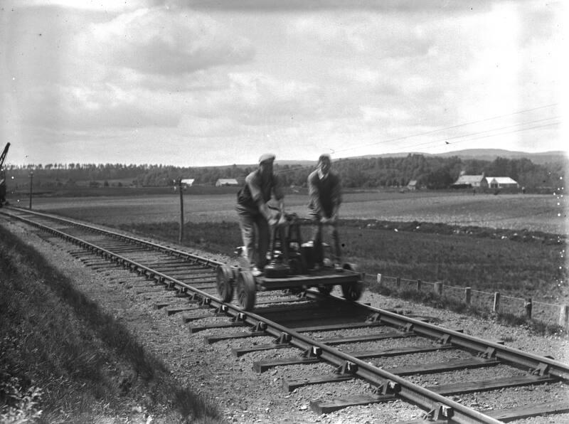 Men On Hand Propelled Bogie