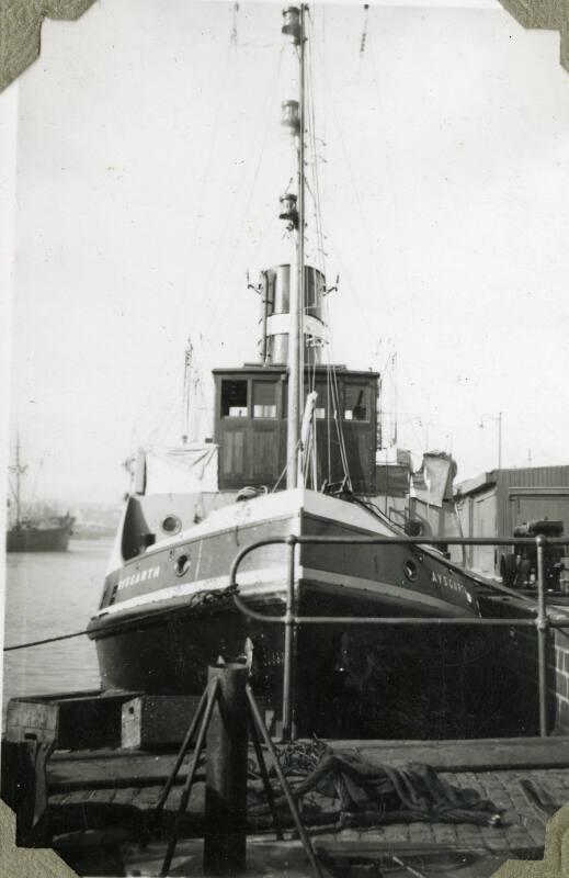 Black and White Photograph in album of tug 'Aysgarth' in harbour