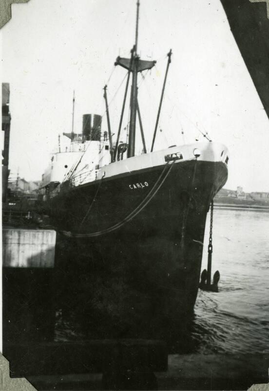 Black and White Photograph in album of ship 'Carlo' at dockside