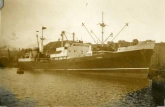 Black and White Photograph in album of ship 'Aberdonian Coast' docked in Aberdeen Harbour