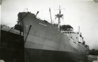 Black and White Photograph in album of ship 'Byfjord' alongside 'Caledonian Coast' in Aberden h…