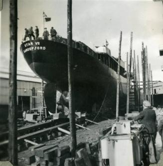 Black and White Photograph in album of 'Star VII' on slipway in shipyard