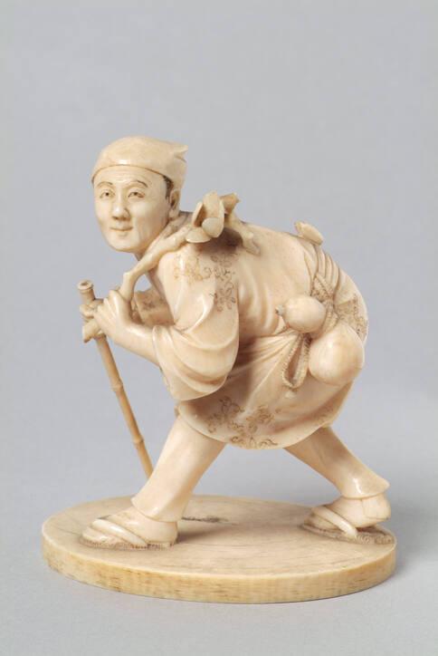 Japanese Carved Okimono Figure of a Crouching Man