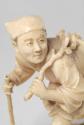 Japanese Carved Okimono Figure of a Crouching Man