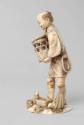 Japanese Carved Okimono Figure of a Man with Rabbits