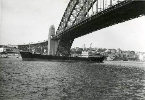 Black and white photograph Showing 'Meringa' passing under Sydney Harbour Bridge