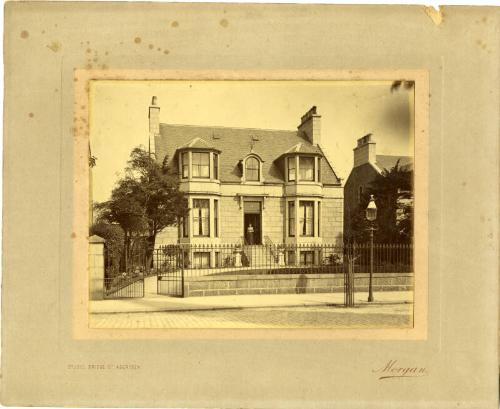 Woman At Front Door Of House