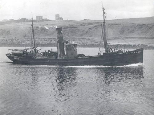 Black and white photograph showing the Trawler A420 'Jean Stephen' entering harbour, view of st…