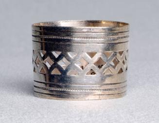 Napkin ring with inscribed lines and triangular cutouts