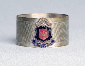 Silver coated breass napkin ring with enamel crest