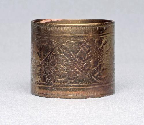 Brass napkin ring with floral design