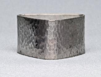 Triangular pewter napkin ring