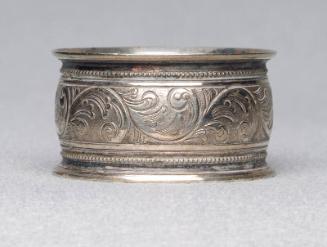 Silver plated napkin ring with engraved floral band