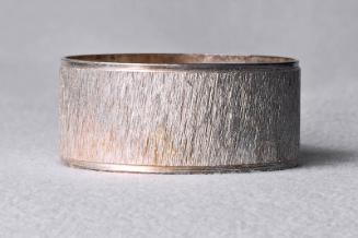 Silver plated circular napkin ring with diamond cut surface