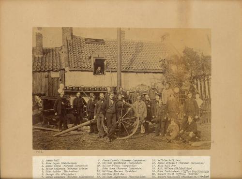Photograph of workers of Alexander Hall Shipyard Standing in Front of Buildings, framed