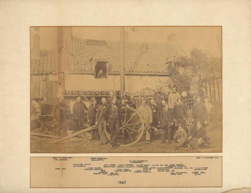 Photograph of workers of Alexander Hall Shipyard Standing in Front of Buildings, framed