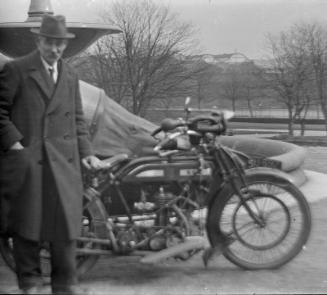 Man Standing by Motorcycle and Sidecar
