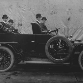 Men Seated in Car