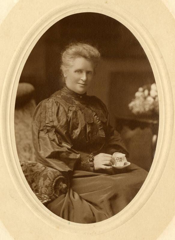 Black and white photograph Showing An Older Woman, Seated With Tea, Either A Duthie Or Duthie-Related