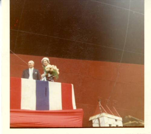 Colour photograph showing view of woman with bottle of champagne with John Wright, Managing Director of Hall Russell's just prior to launch