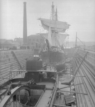 steamer and sailing vessel in the graving dock at Aberdeen Harbour