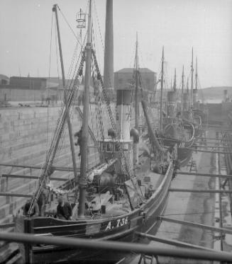 four steam trawlers in the graving dock, Aberdeen Harbour