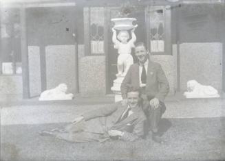 Two men with Seated in Garden Members of Dr Walford Bodie's Family?/Friends?