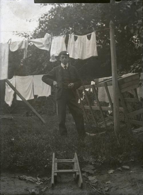 Boy Standing in Garden by Washing