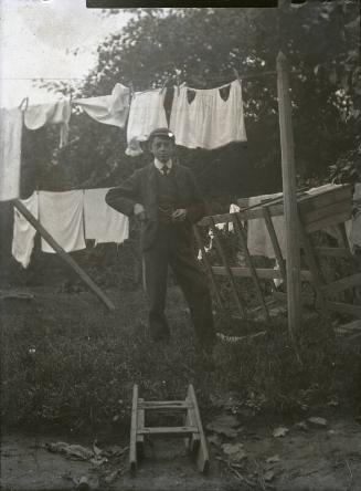 Boy Standing in Garden by Washing