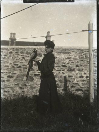 Women with Parrot in Garden  Member of Dr Walford Bodie's Family?