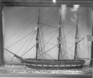 unidentified ship model in a glass case
