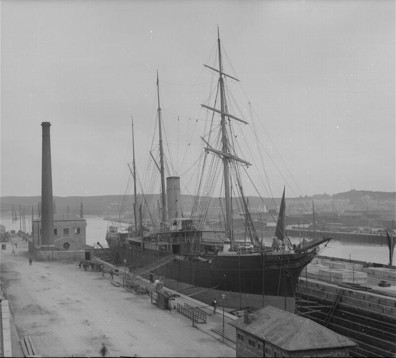 Glass plate showing the steamship 'Aberdeen' in the graving dock atAberdeen Harbour, with herri…