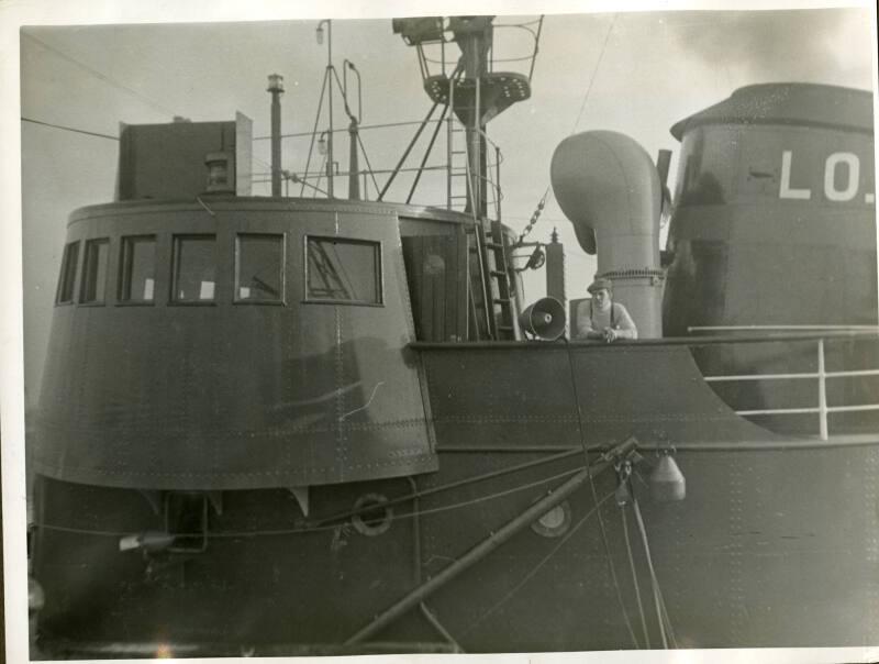Photograph in album showing trawler Red Hackle
