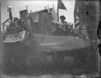 Decorated float in unidentified celebration procession.