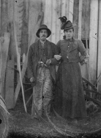 Glass negative of a Man and woman, arm in arm