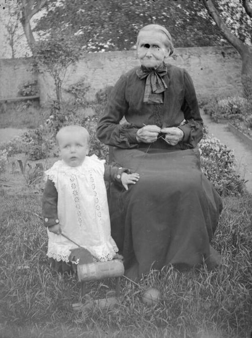 Seated Women With Child With Toy Horse