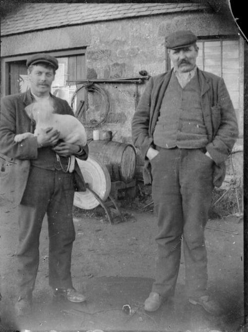 Two men Standing in Work Yard